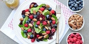 Spring Salad with Mixed Berries, Candied Almonds, and Honey Citrus Vinaigrette ~ a beautiful, delicious salad with vibrant flavors and varied textures | FiveHeartHome.com