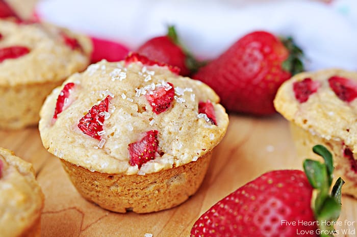 Tender and fluffy Whole Wheat Strawberry Muffins studded with sweet strawberries for a juicy pop in every bite! | LoveGrowsWild.com