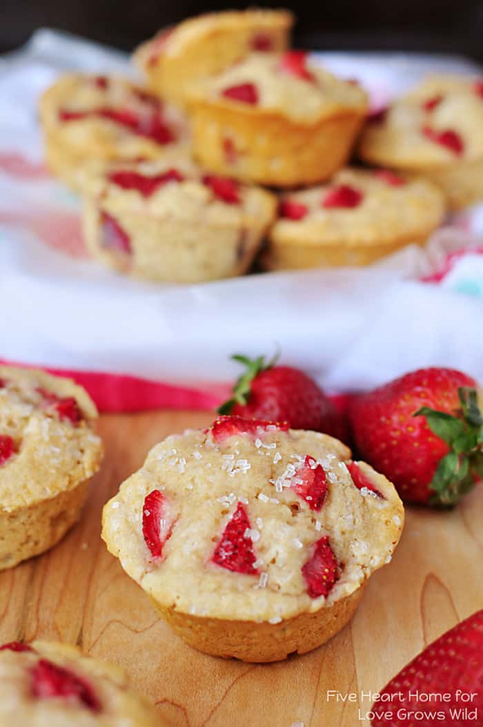 Tender and fluffy Whole Wheat Strawberry Muffins studded with sweet strawberries for a juicy pop in every bite! | LoveGrowsWild.com