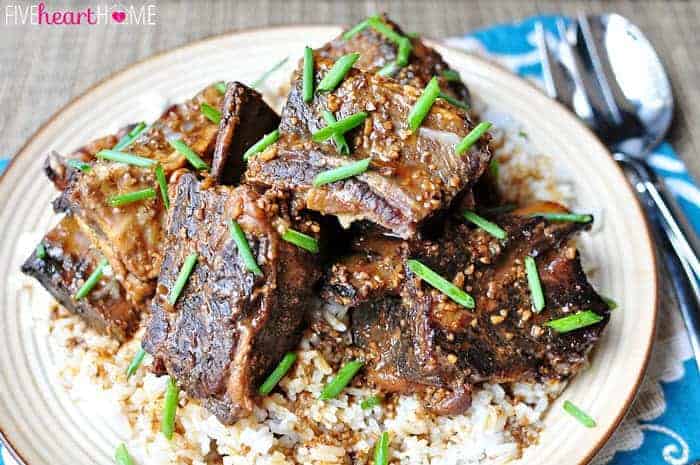 Asian Short Ribs garnished with chives over rice.