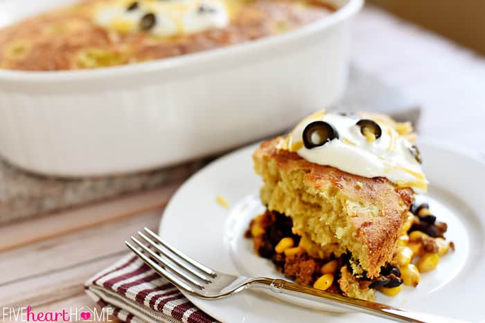 Mexican Cornbread Casserole on white plate with fork.