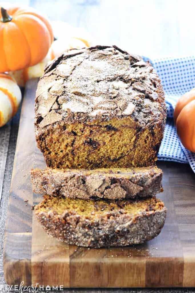 Sliced Snickerdoodle Pumpkin Bread on a cutting board