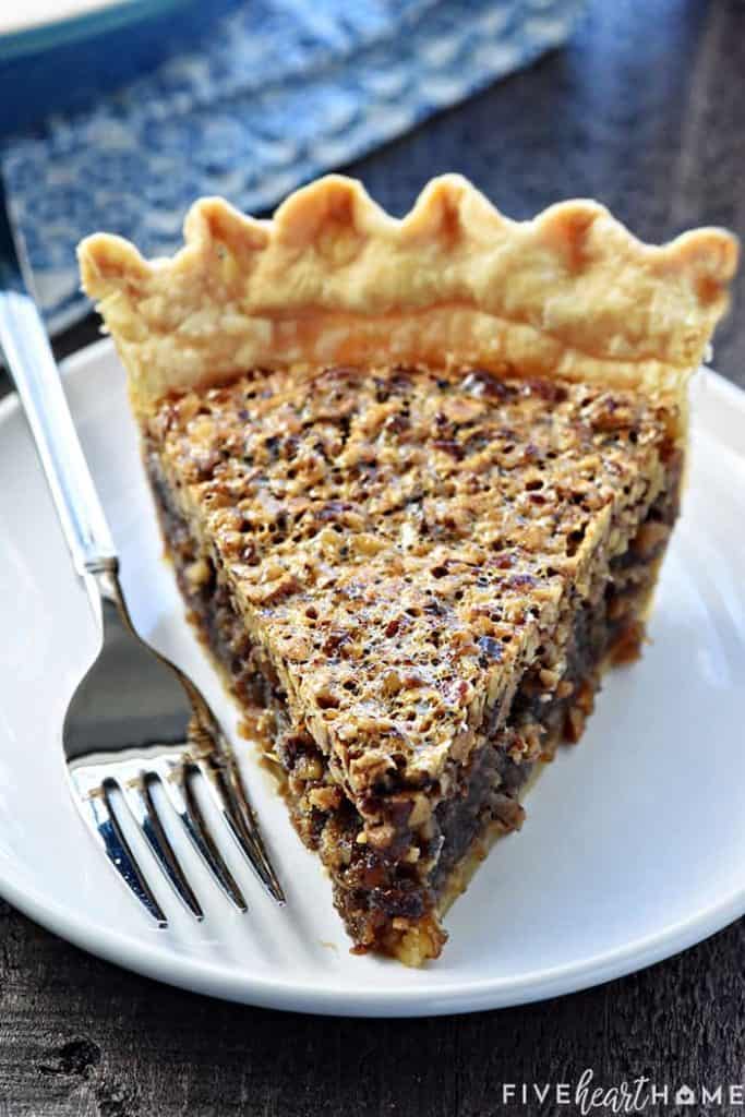 The BEST Pecan Pie ~ foolproof and perfect every time, with an abundance of toasty pecans floating on a thick, glossy filling in a flaky, all-butter pie crust! | FiveHeartHome.com