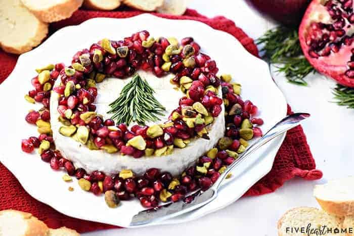 Christmas Brie ~ a simple, red-green-and-white holiday appetizer featuring Brie, pomegranate, and pistachios, garnished with a festive rosemary Christmas tree! | FiveHeartHome.com