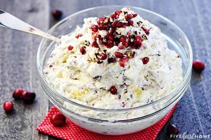 Cranberry Pomegranate Fluff Salad ~ a new twist on the classic recipe, loaded with tart cranberries, sweet pomegranate arils, crushed pineapple, toasty pecans, chewy coconut, fluffy marshmallows, and fresh whipped cream for a delicious holiday side dish! | FiveHeartHome.com