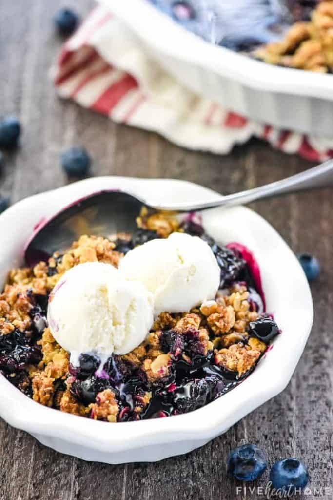 Blueberry Crisp ~ this quick, easy, amazing dessert recipe boasts sweet and syrupy blueberries with a crunchy golden oat topping...and it's even better served warm with a scoop of vanilla ice cream on top! | FiveHeartHome.com #blueberrycrisp