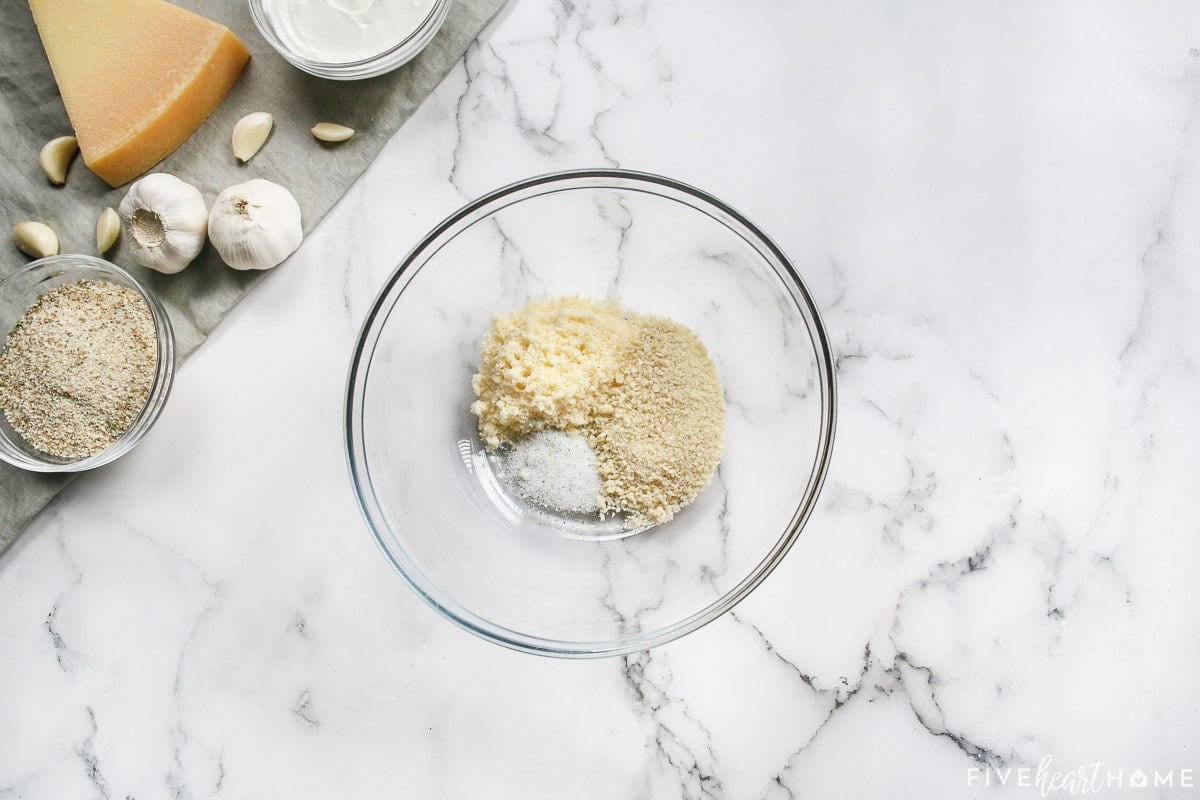 Panko breadcrumbs, grated Parmesan, and garlic salt in a bowl.