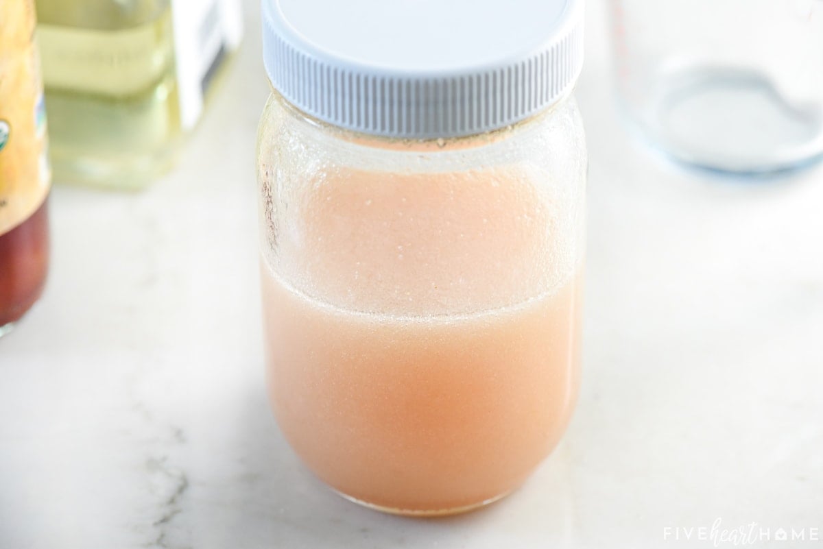 Jar of shaken salad dressing.