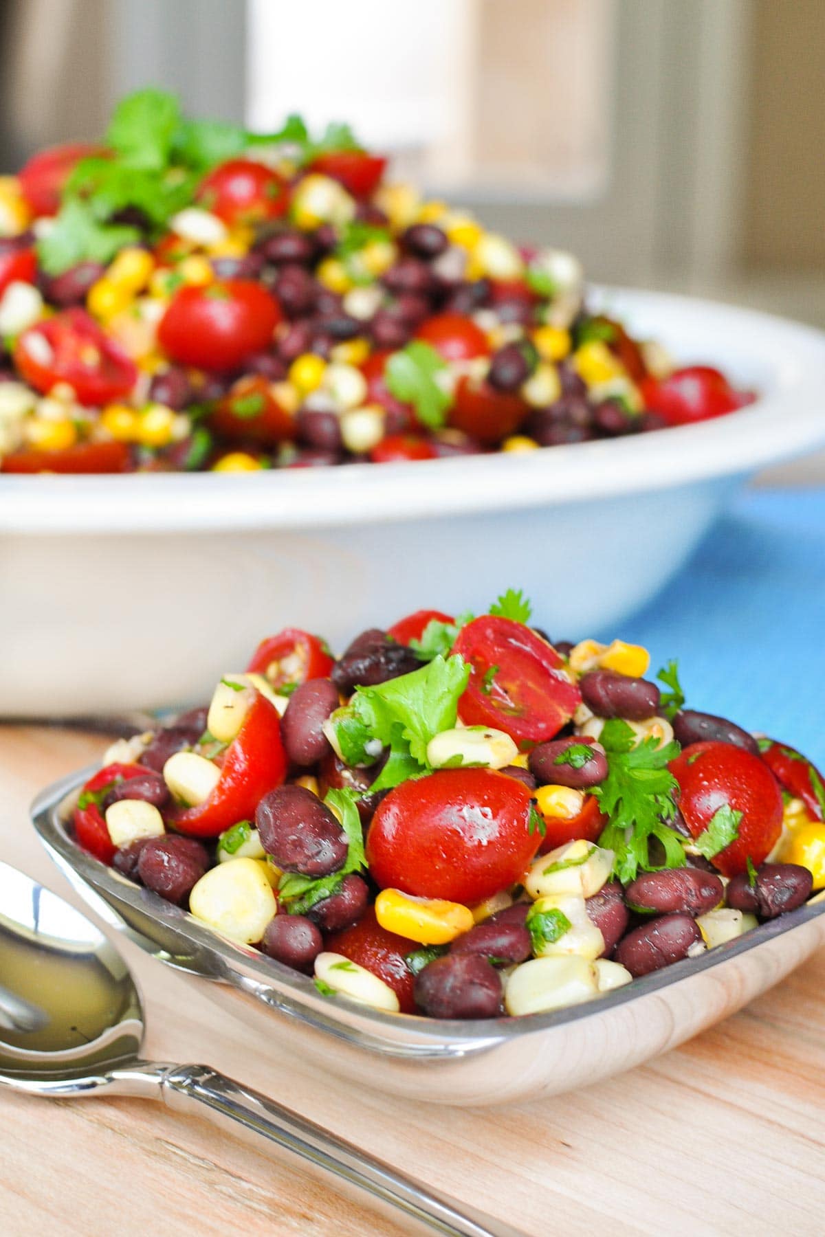 Black Bean and Corn Salad in small bowl and large serving bowl.