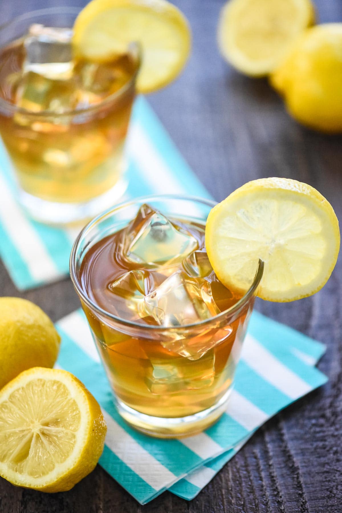 Spiked Arnold Palmer recipe in two glasses.