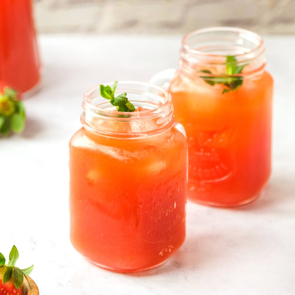 Strawberry Punch in two glasses with mint.