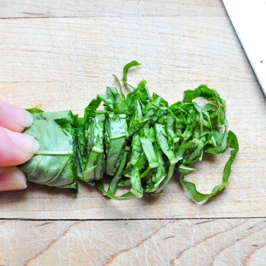 Ribbons of basil for pasta salad with tortellini.