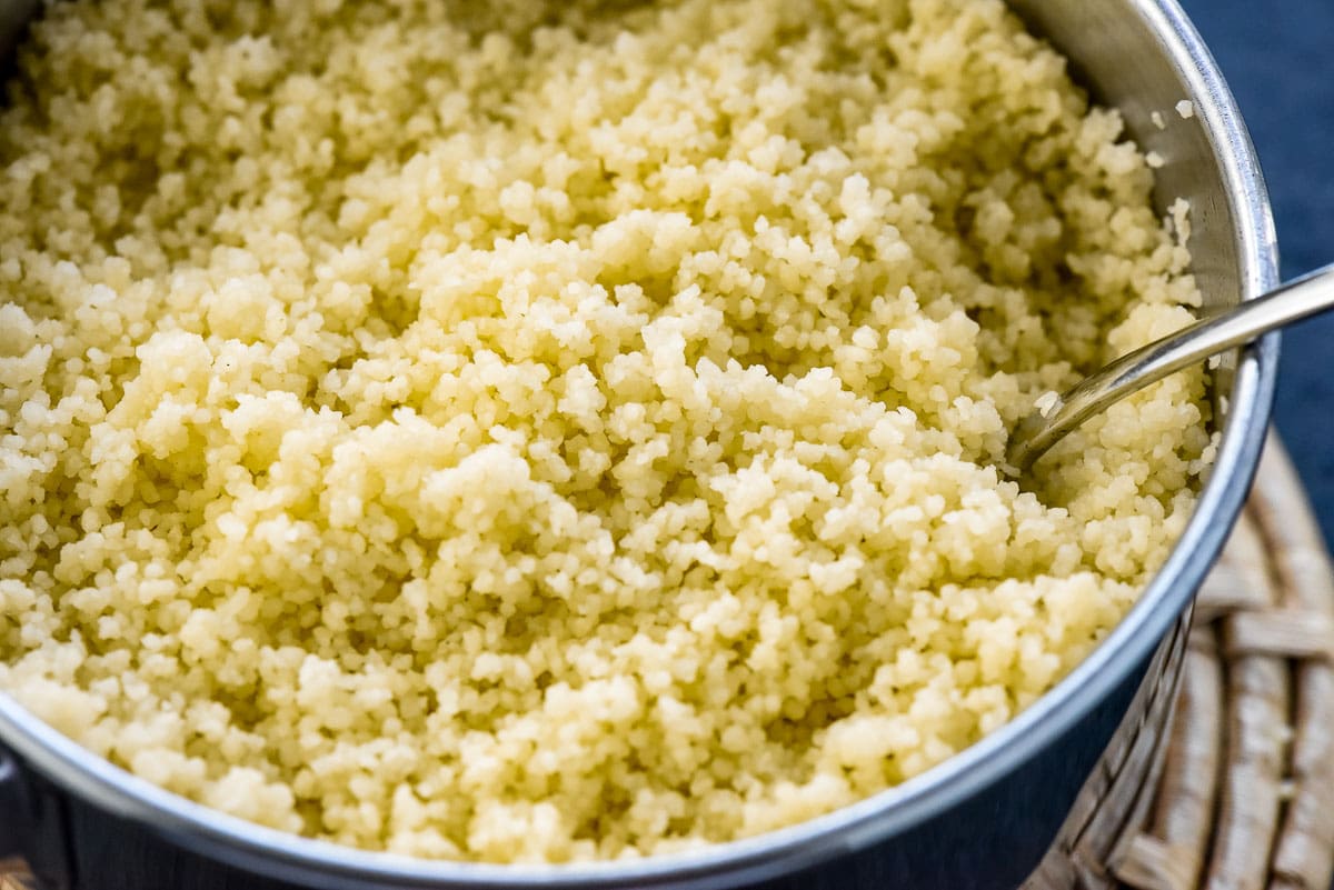 Close-up of fluffed couscous in pot.