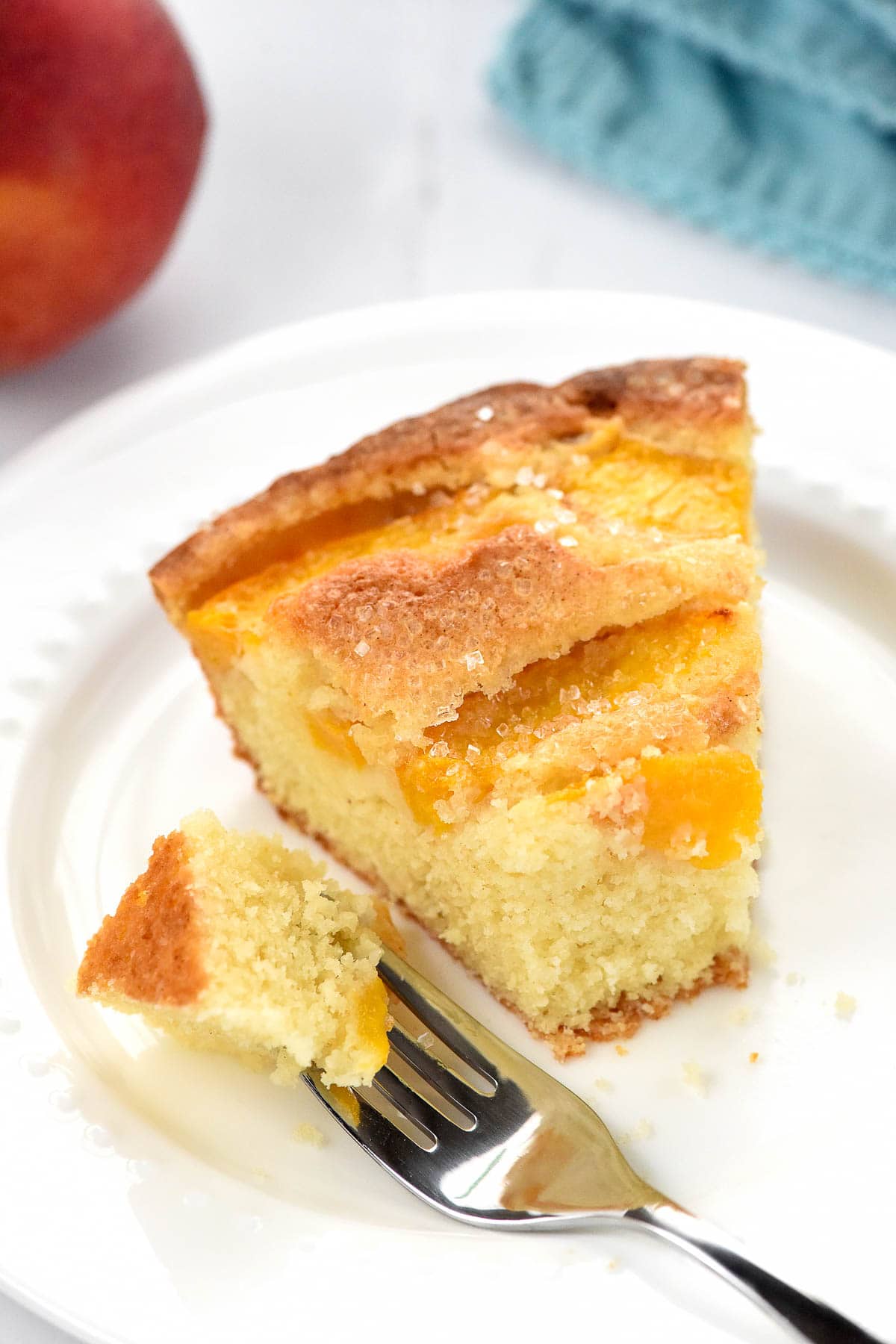 Peach Cake with bite on fork.