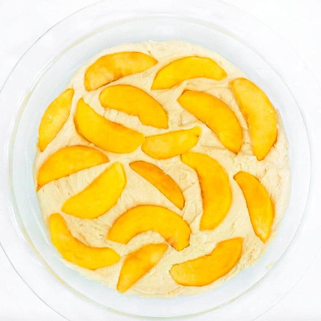 Peaches pressed into the top of the Peach Cake batter.