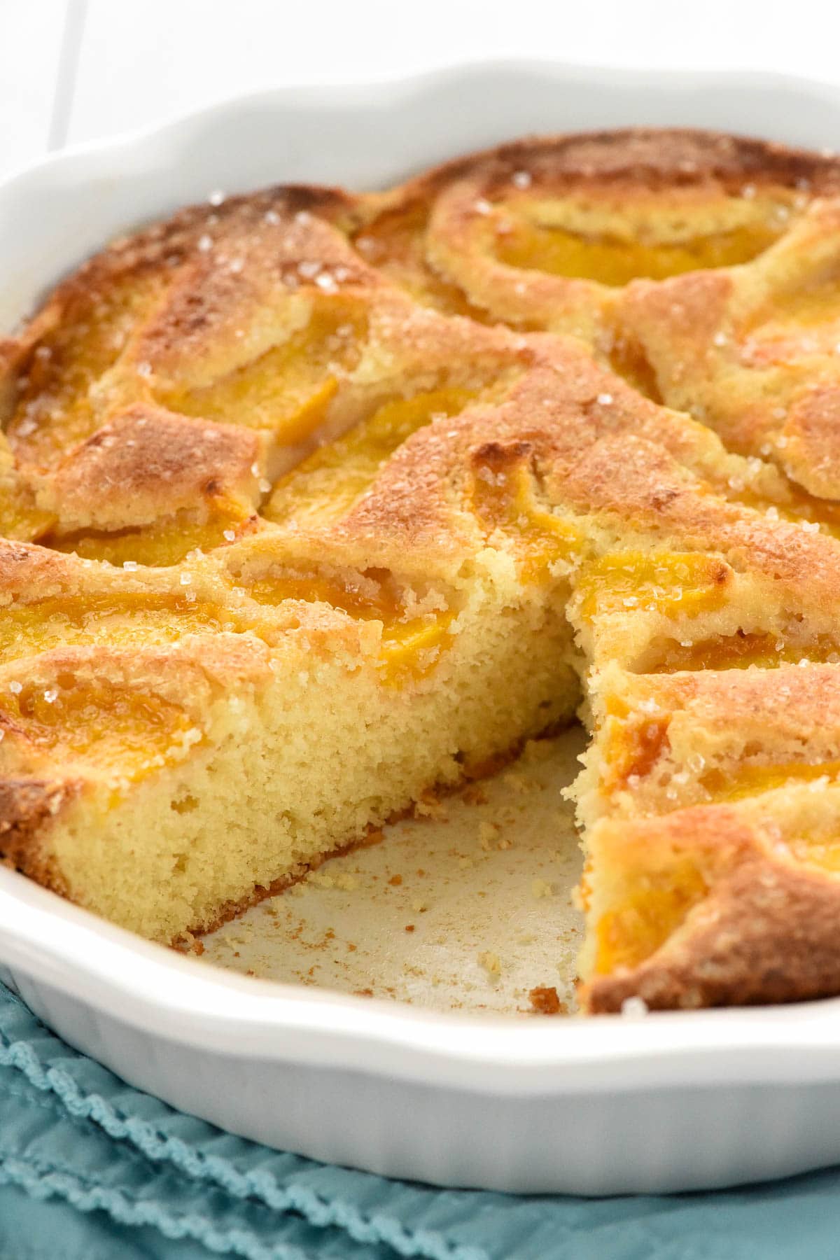 Peach Cake with missing slice.