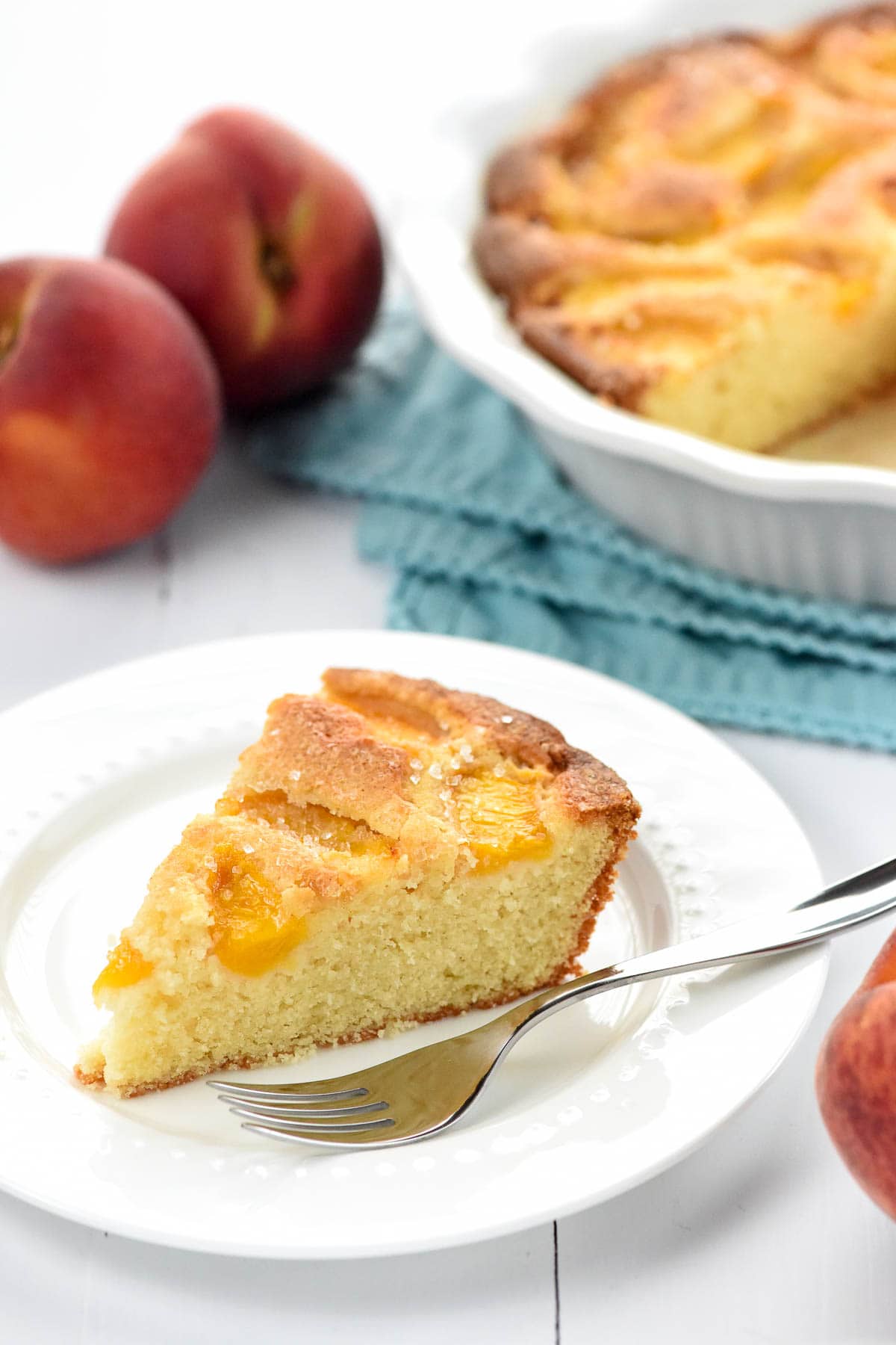 Peach Cake recipe on plate and in baking dish.