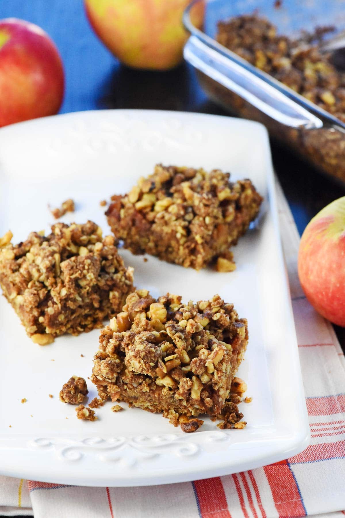 Apple Butter Bars on plate with baking dish in background as one of the best apple butter uses.