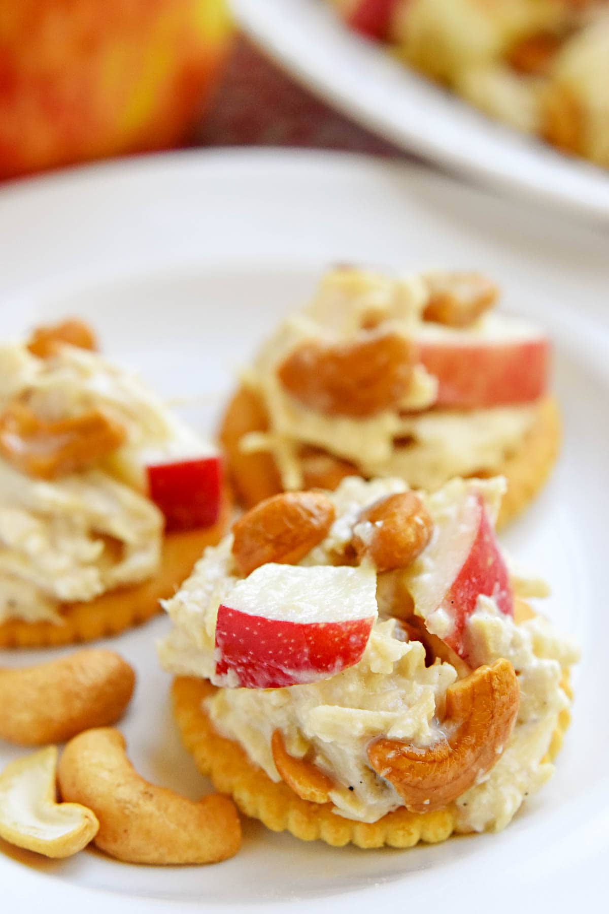 Close-up of Chicken Salad with Apples on crackers.