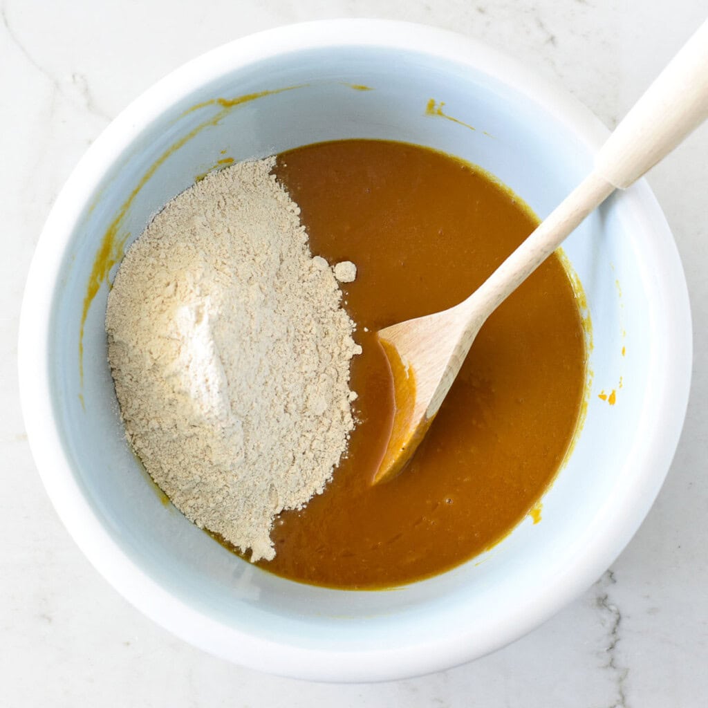 Adding flour to batter.