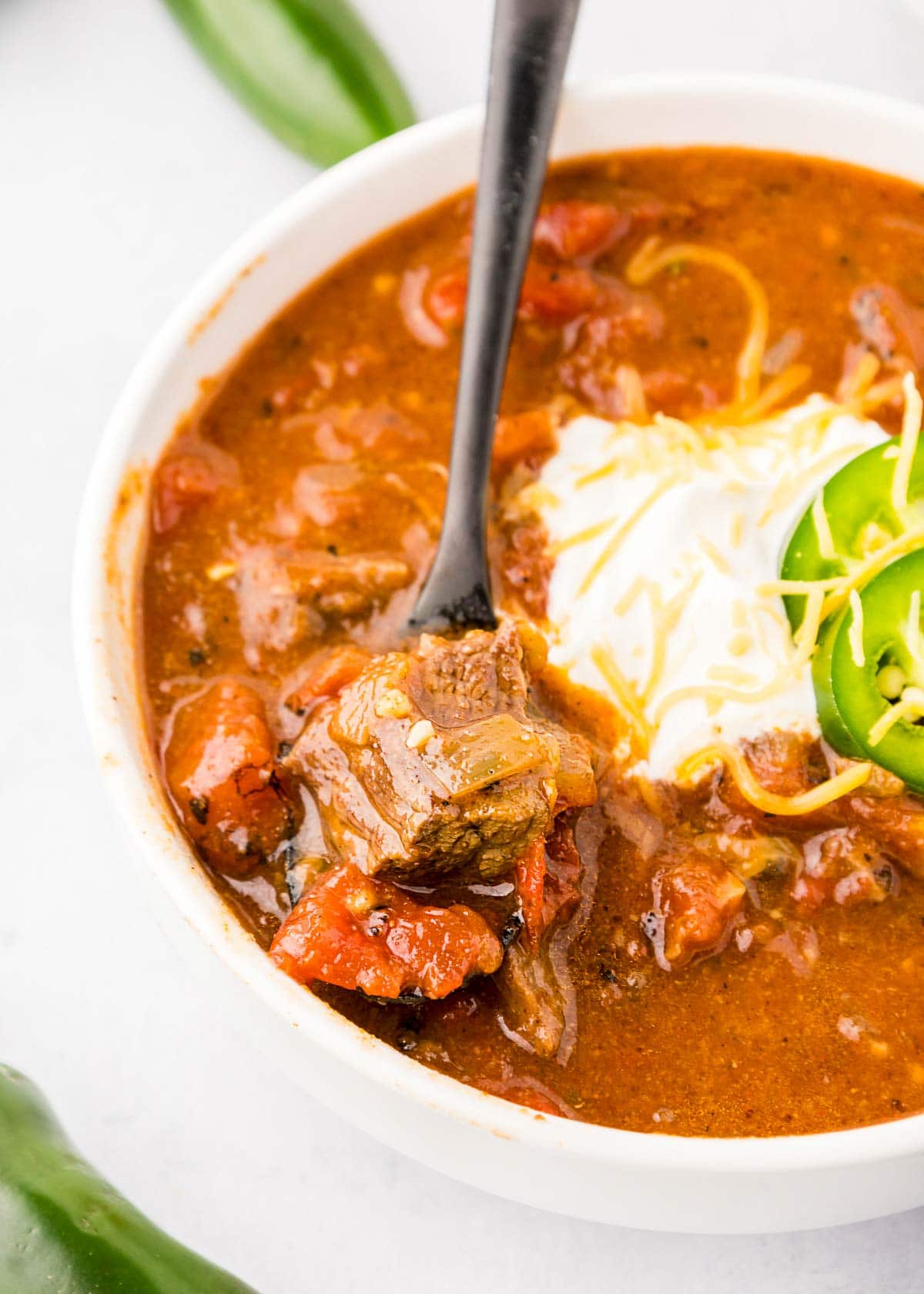 Texas Chili with spoon scooping up chunk of beef.