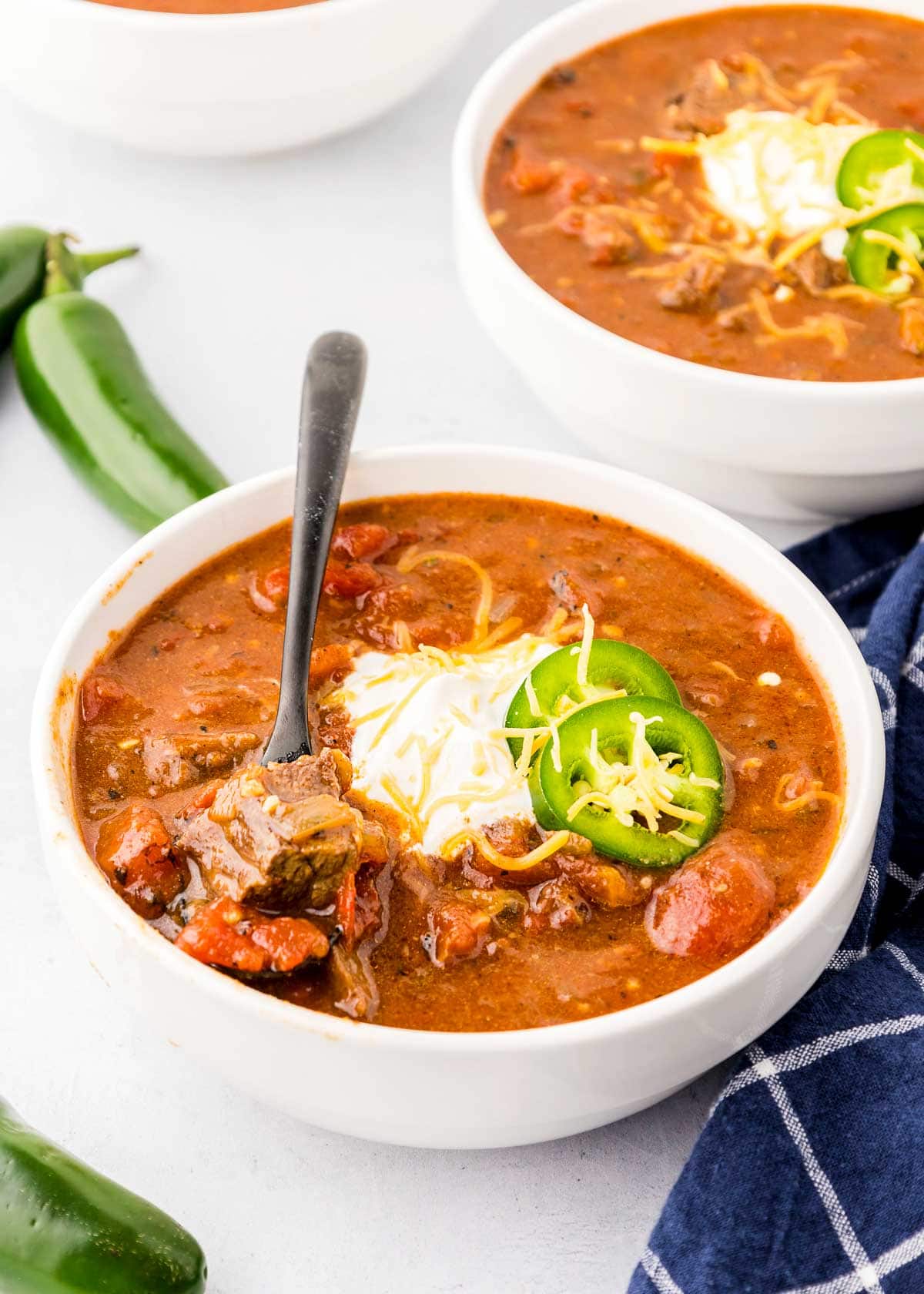 Texas Chili in bowls with spoon.