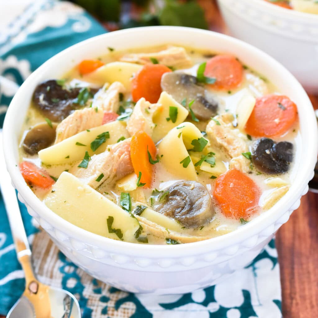 Crock Pot Chicken Noodle Soup with carrots and mushrooms.