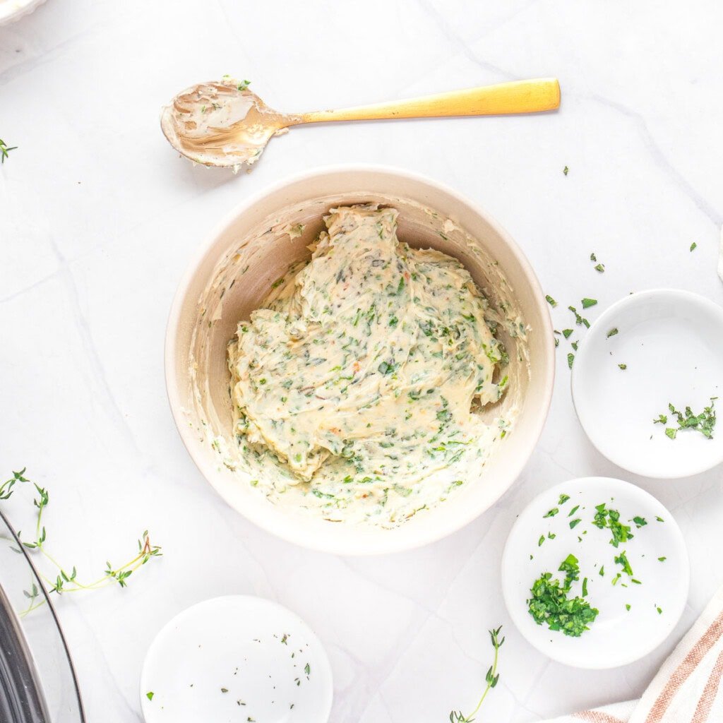 Herb butter in bowl for Slow Cooker Turkey Breast.