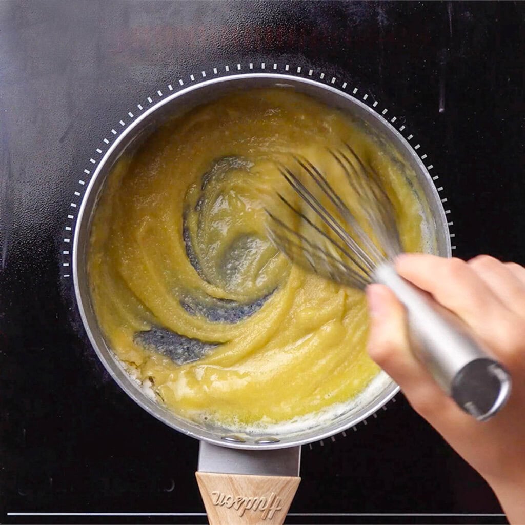 Whisking flour into butter.