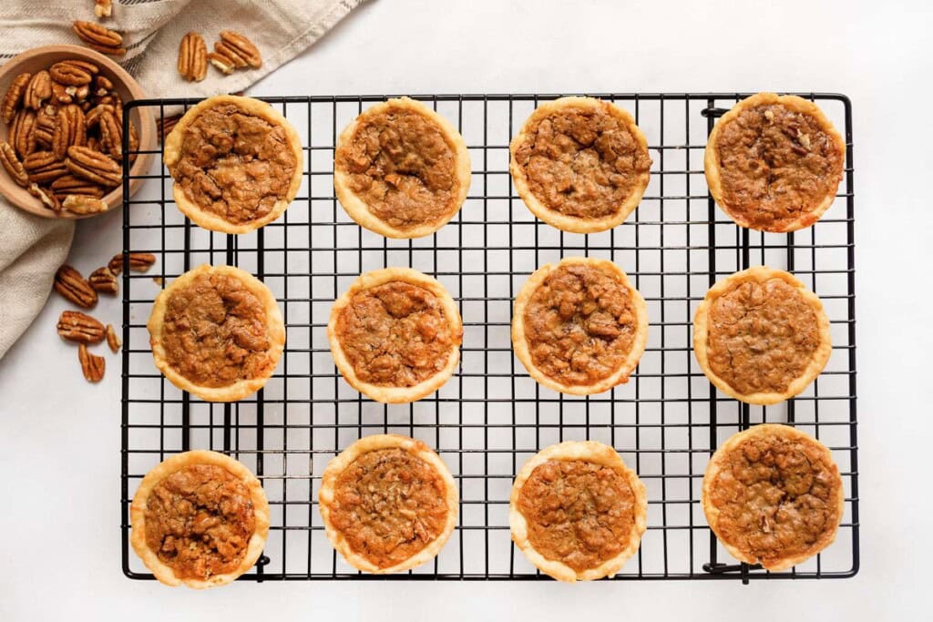 Pecan mini pie on cooling rack.