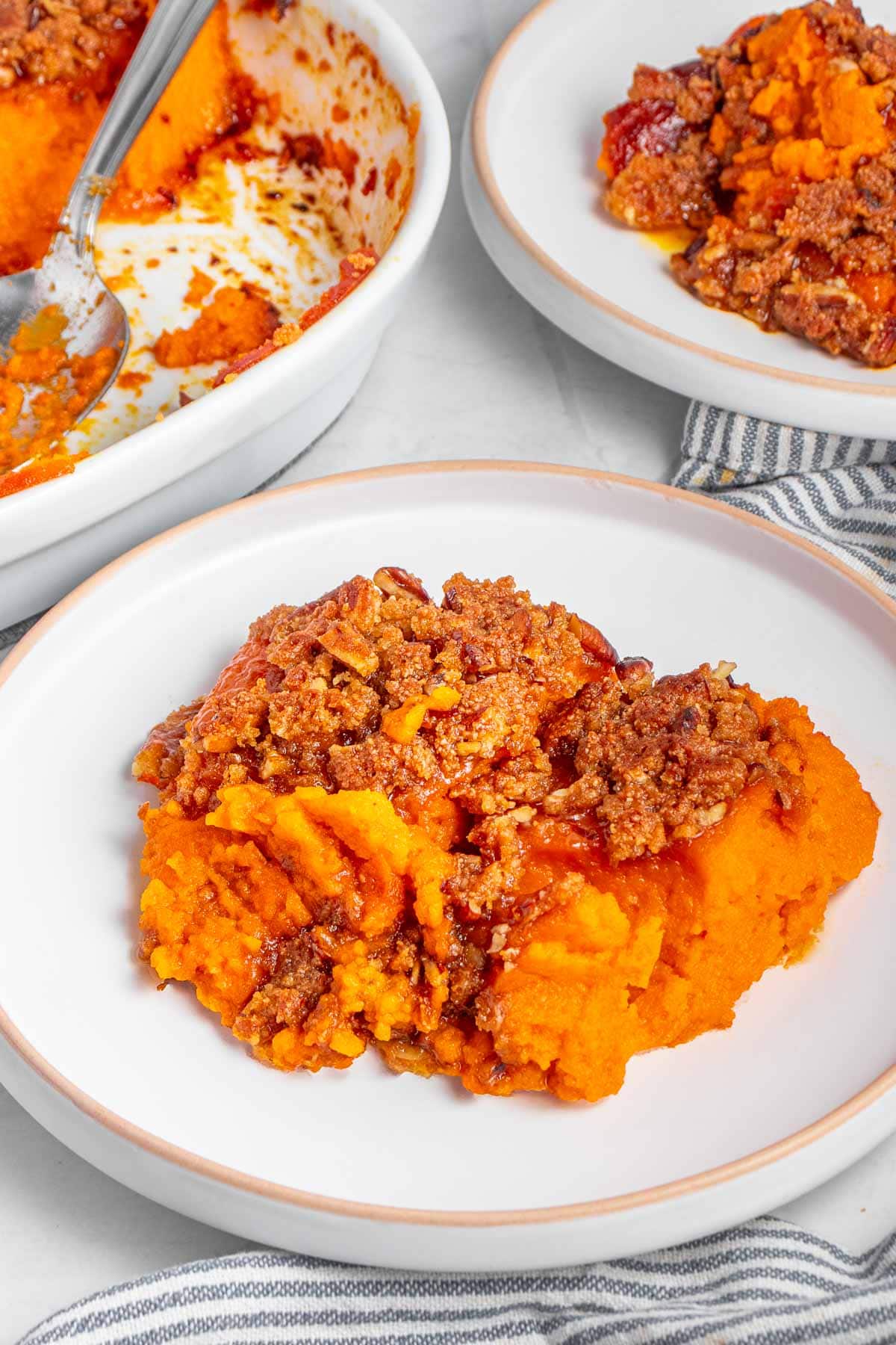 Old-Fashioned Sweet Potato Casserole on plates and in dish.