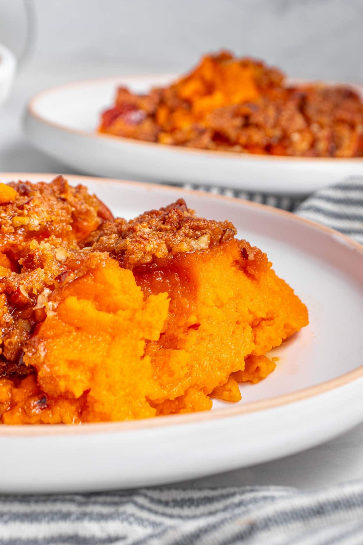 Close-up of Old-Fashioned Sweet Potato Casserole on plate.