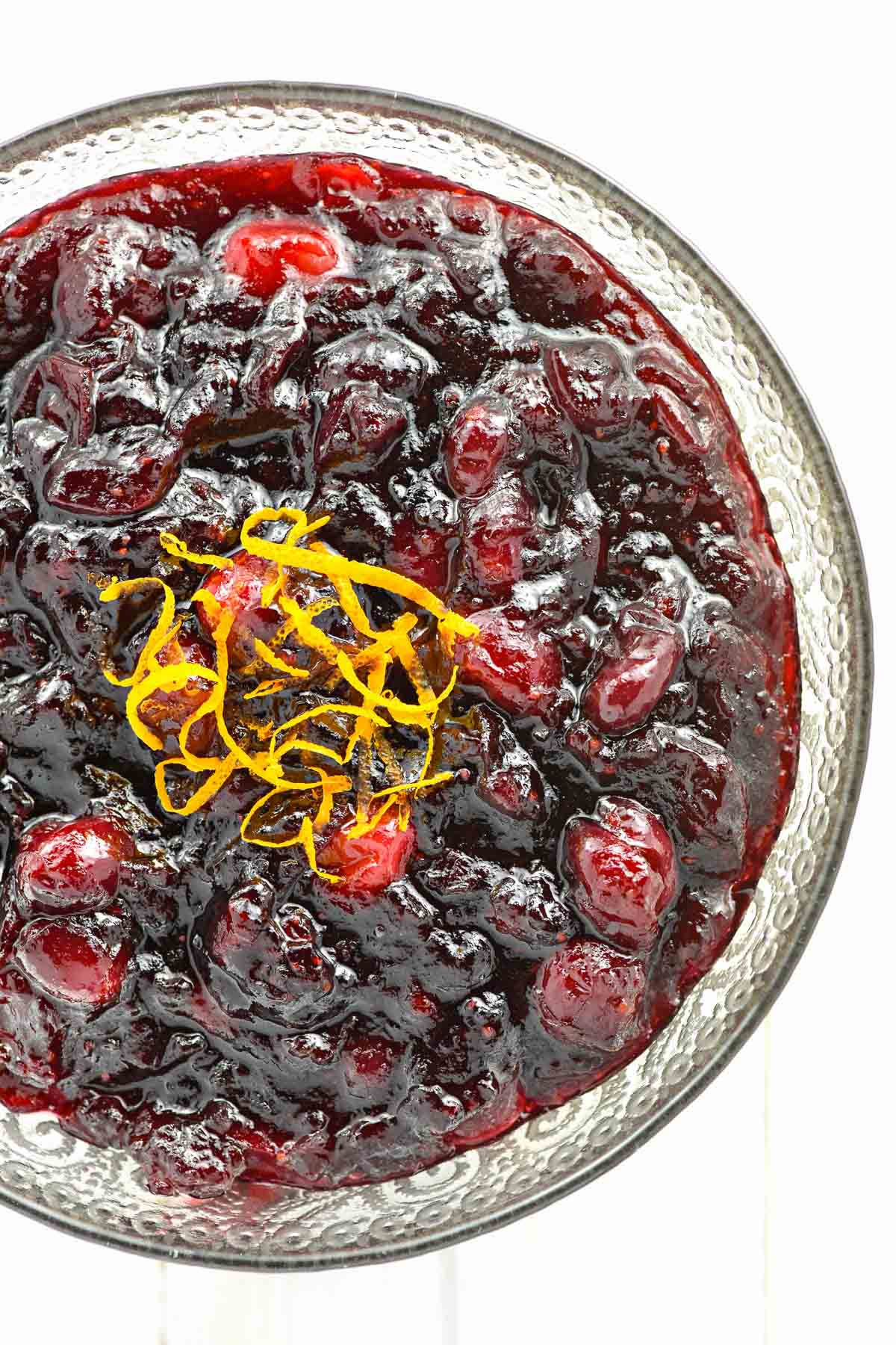 Cranberry Sauce Recipe with Orange in glass bowl.