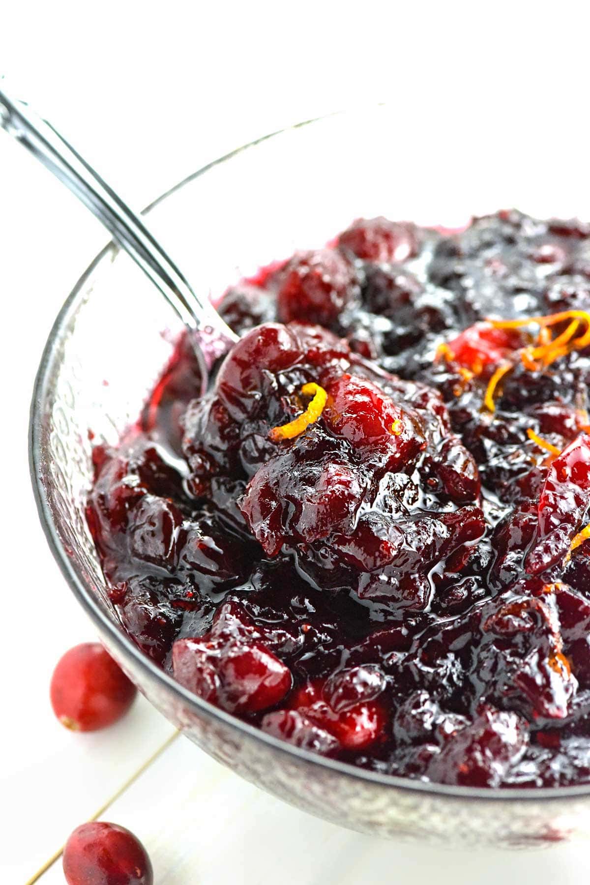 Cranberry Sauce with Orange in bowl with spoon.