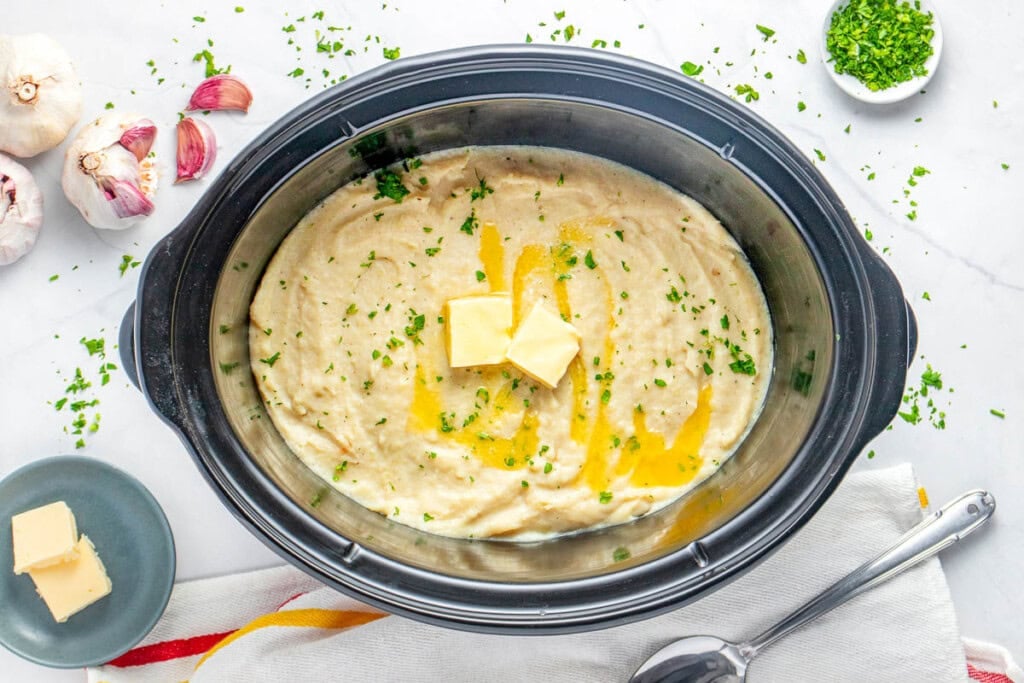 Aerial view of mashed potatoes in crock pot.