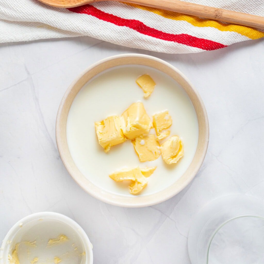 Milk and butter in bowl.