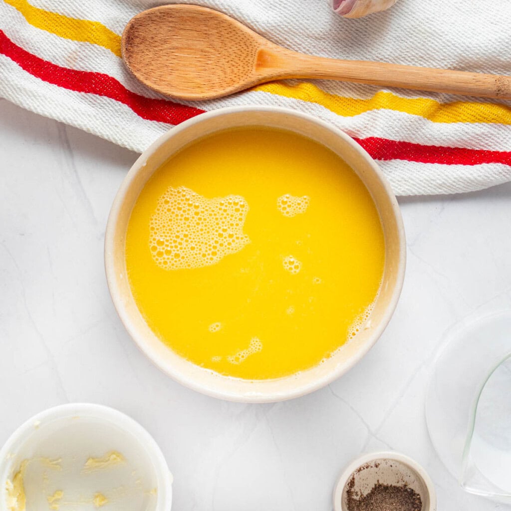 Butter melted into milk for Crock Pot Mashed Potatoes recipe.