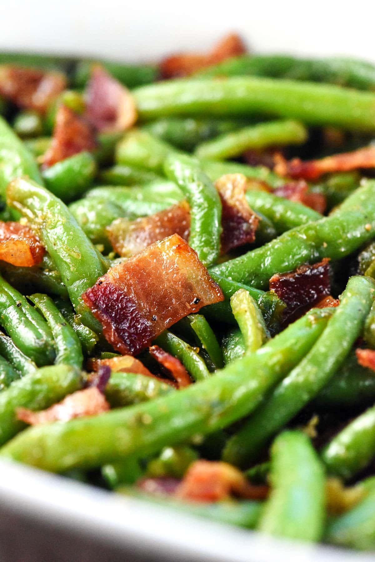 Close-up of green beans with bacon.