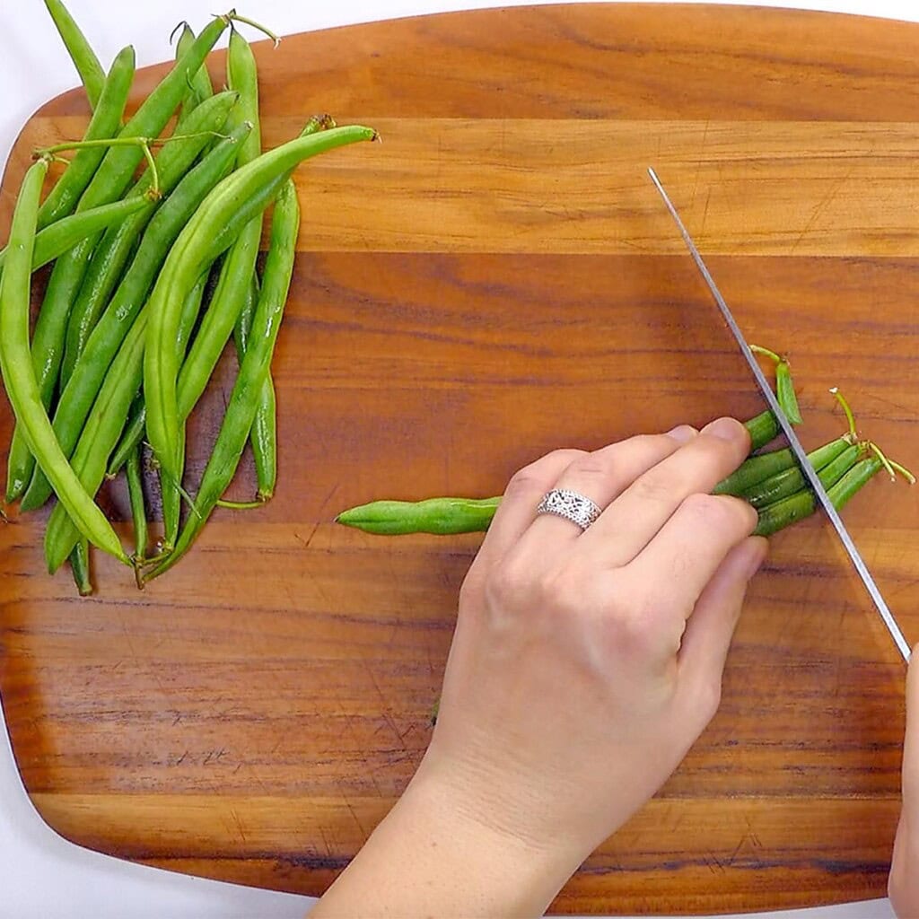 Trimming fresh green beans for green bean and bacon recipe.