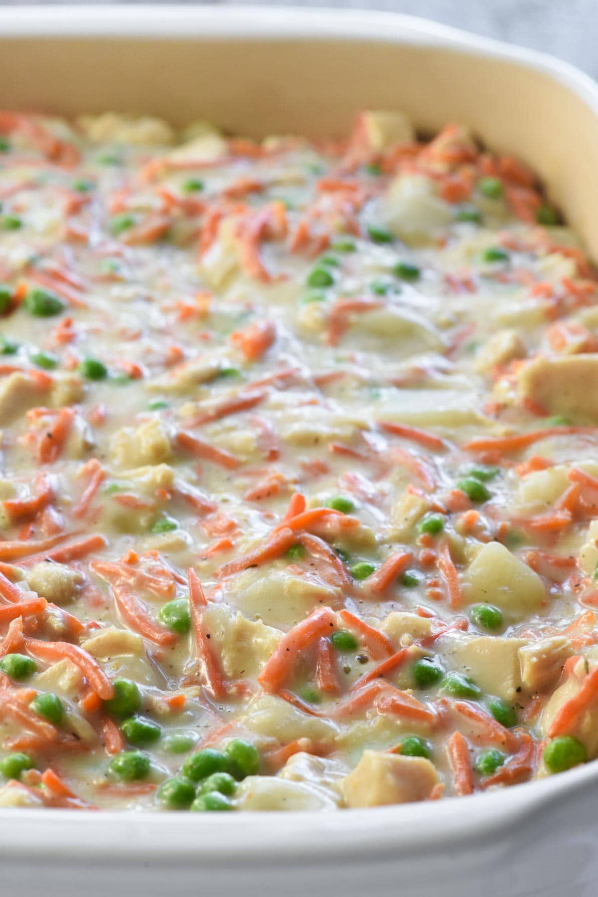 Chicken Pot Pie Casserole filling transferred to baking dish.