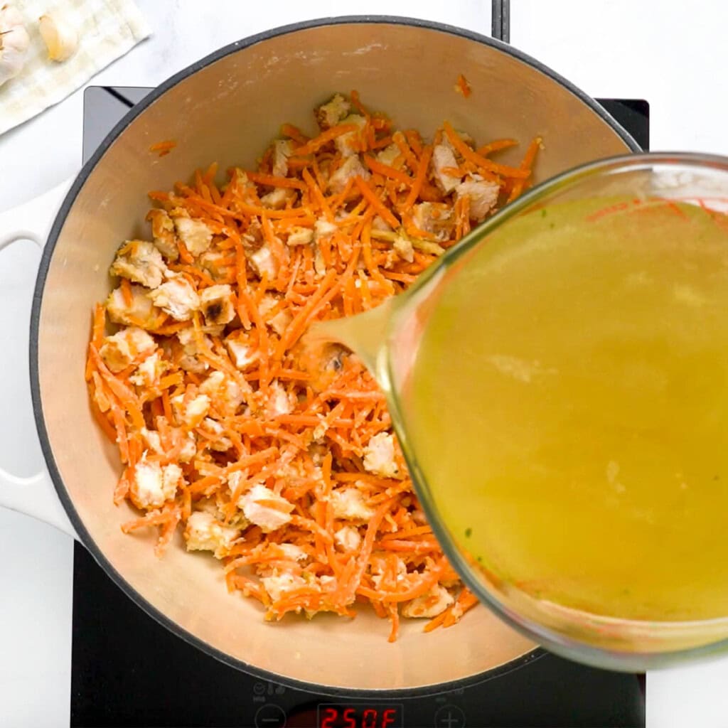 Adding broth to make easy Chicken Pot Pie Casserole filling.