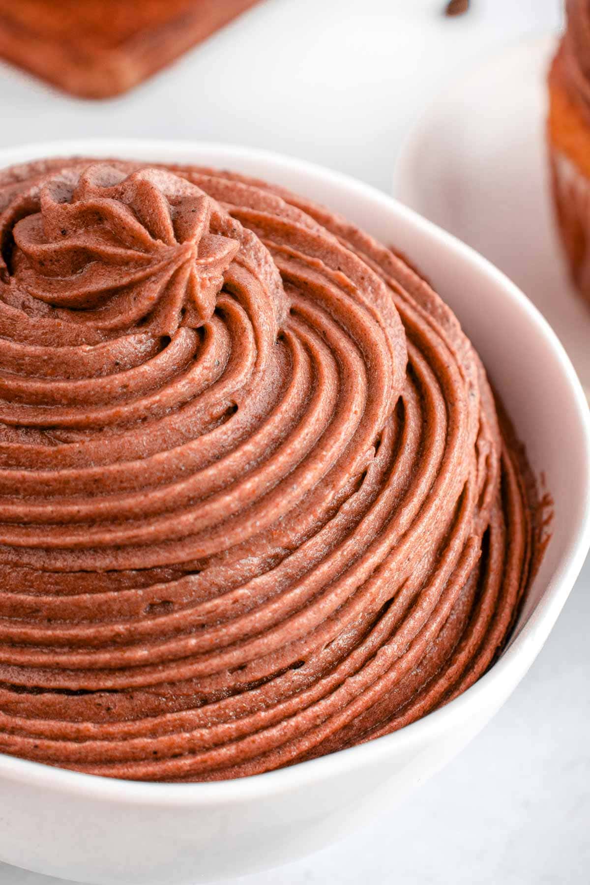 Close-up of Chocolate Cream Cheese Frosting in white bowl.