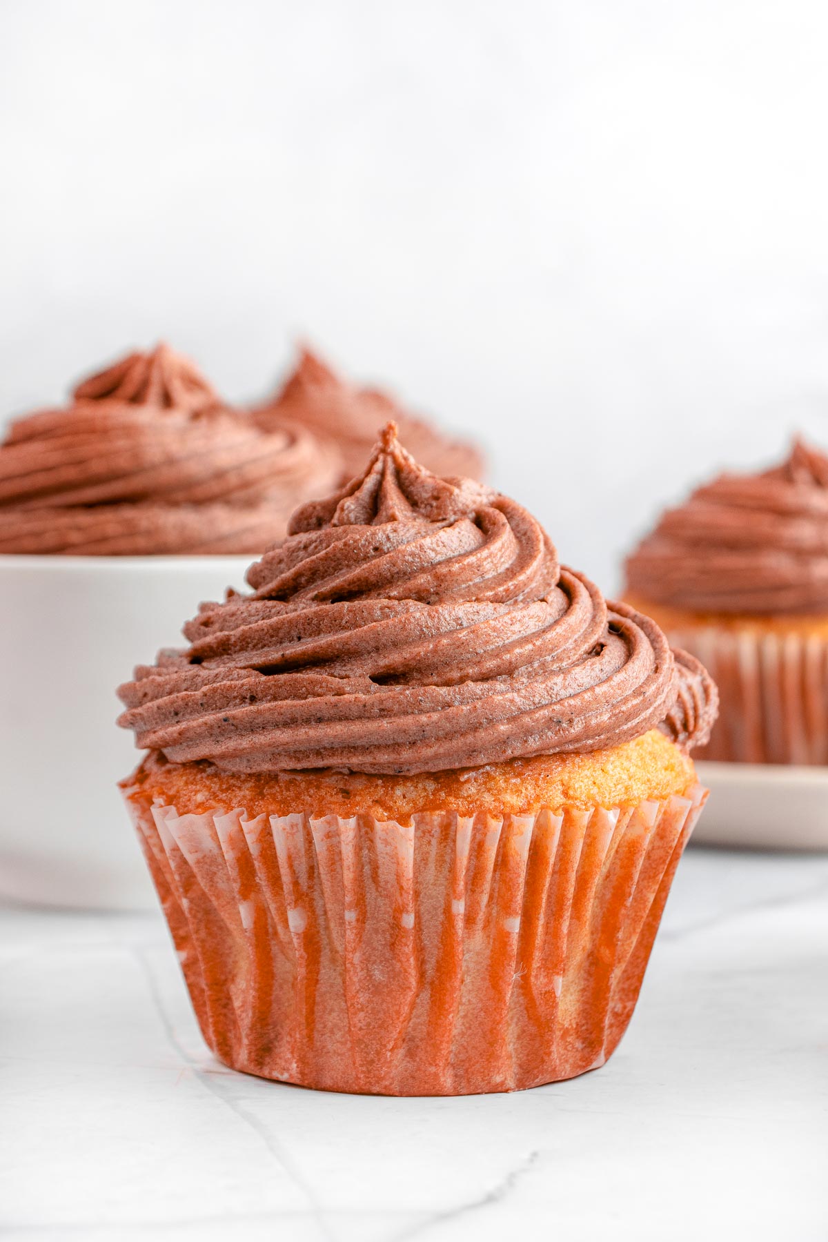 Chocolate Cream Cheese Frosting piped onto cupcake.