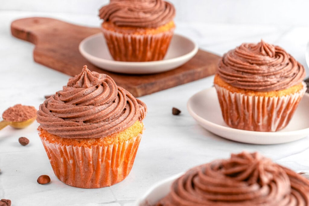 Chocolate Cream Cheese Frosting piped onto cupcakes.