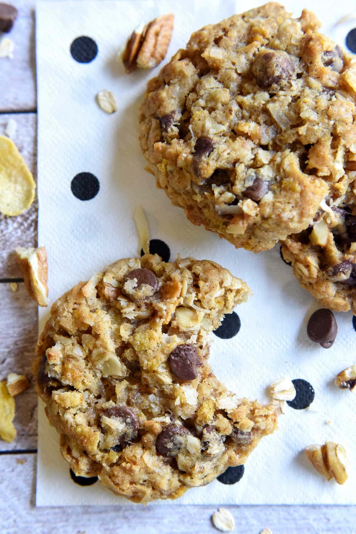 Cowboy Cookies recipe on table with missing bite.