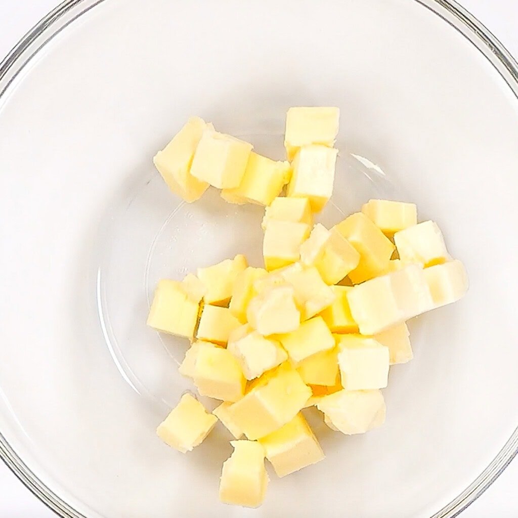 Butter in glass bowl.