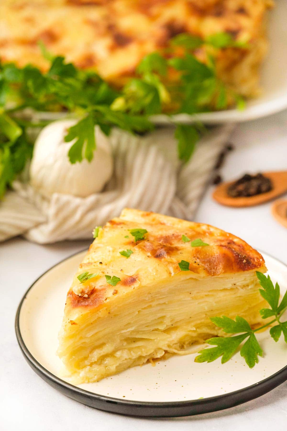 Gruyere Scalloped Potatoes served on white plate.