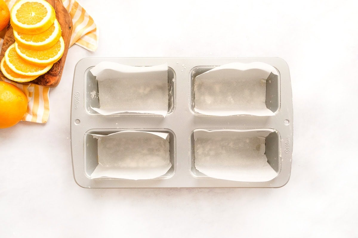 Greased loaf pan lined with parchment paper.