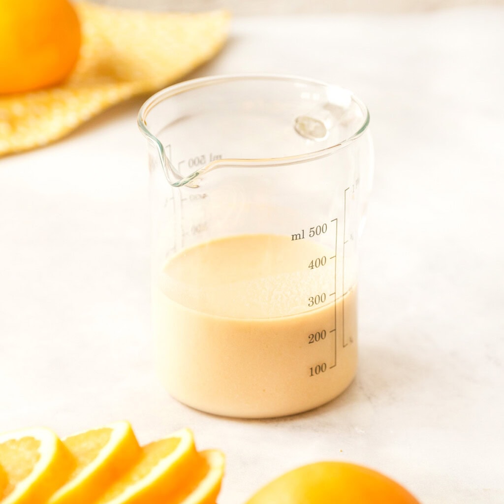 Measuring cup of buttermilk mixture.