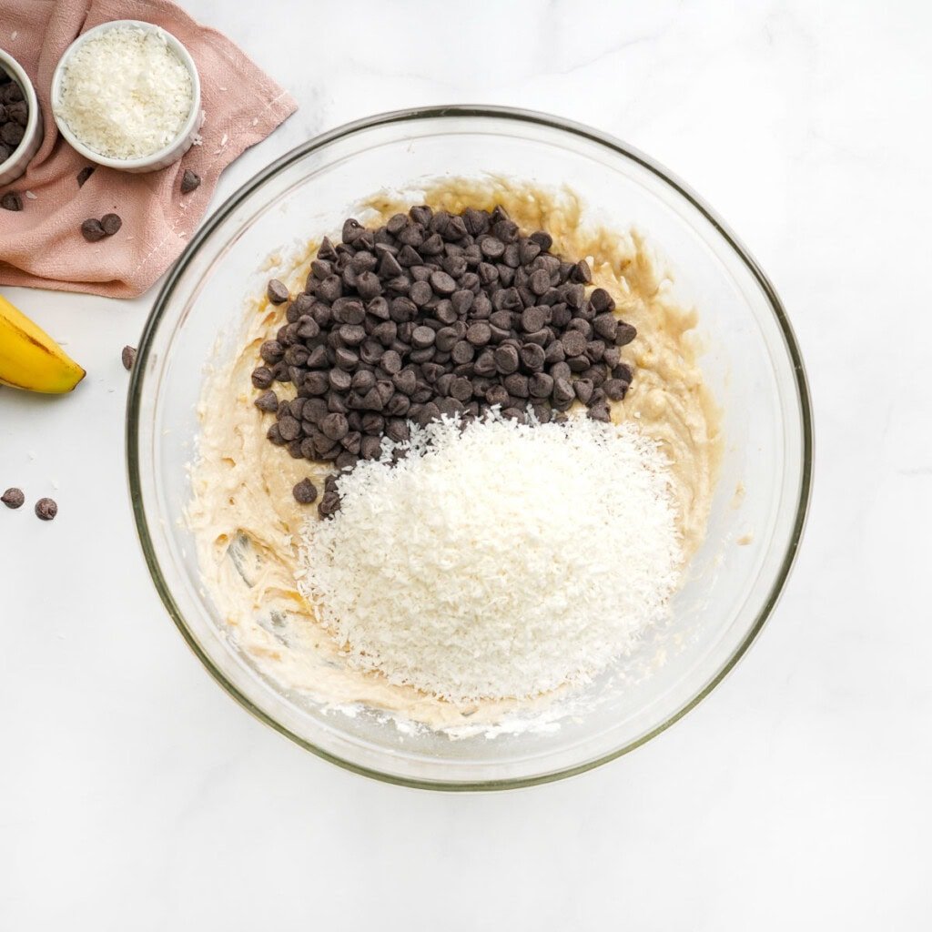 Adding chocolate chips to Chocolate Chip Banana Bread recipe, along with optional coconut.